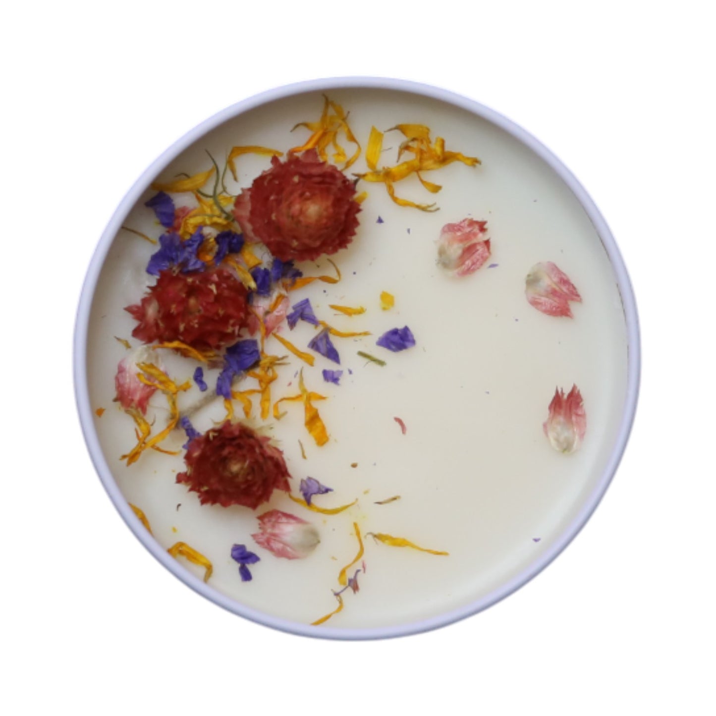 Garden Party Wickless candle showing the dried mixed flowers on top of the wax